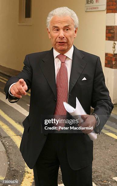 Lord Levy gestures to photographers as he leaves his office on March 6, 2007 in London. Labour Party chief fundraiser Lord Levy is at the centre of...