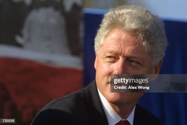 President Bill Clinton listens to speeches during the World War II Memorial Groundbreaking Ceremony on the National Mall November 11 in Washington.