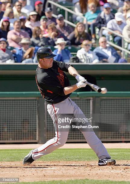 Lance Niekro of the San Francisco Giants swings at the pitch against the Chicago Cubs during spring training March 1, 2007 at Hohokam Park in Mesa,...