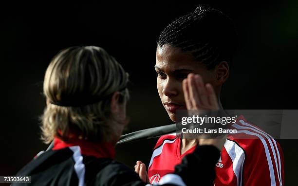 Navina Omilade warms up with Martina Mueller during the German Womens National team training session on March 6, 2007 in Albufeira, Portugal.