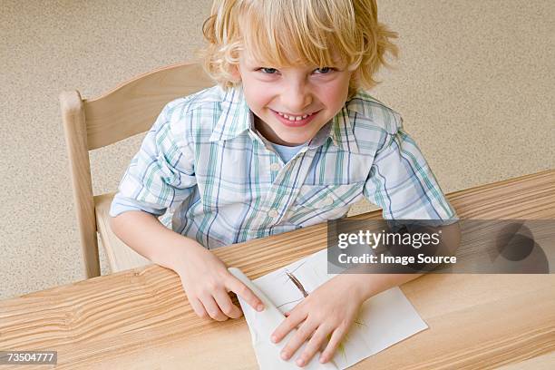 Boy Using Paper 881 Paper Boy Drawing Stock Photos, High-Res Pictures, and Images ...