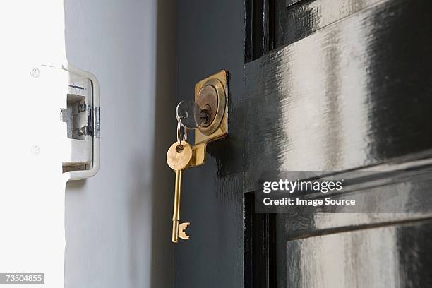 key in open door - key hole stock pictures, royalty-free photos & images