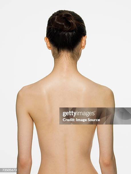 rear view of a young woman - birthday suit stock pictures, royalty-free photos & images