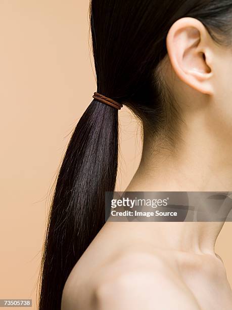 woman's ponytail - ear stock pictures, royalty-free photos & images