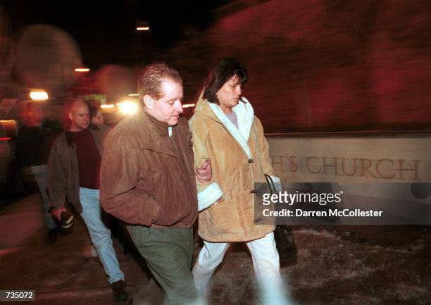 Grief stricken Wakefield, MA residents enter St. Joseph's Church December 28, 2000 directly across the street from Tuesday's workplace massacre at...