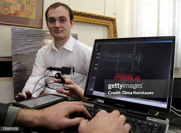 A computerized polygraph machine being used in a simulated situation ...