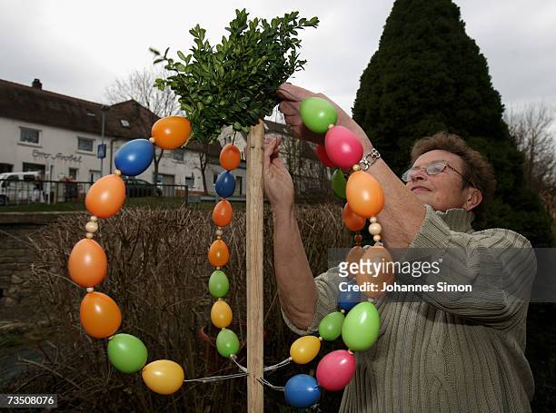 In preparation for the Holy Week Karin Dueppert threads an Easter Crown with coloured eggs on March 6 in Creglingen, Germany. In the nothern...