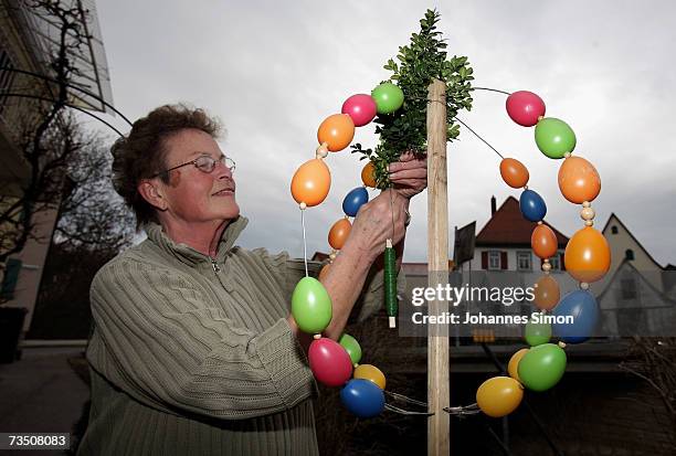 In preparation for the Holy Week Karin Dueppert threads an Easter Crown with coloured eggs on March 6 in Creglingen, Germany. In the nothern...