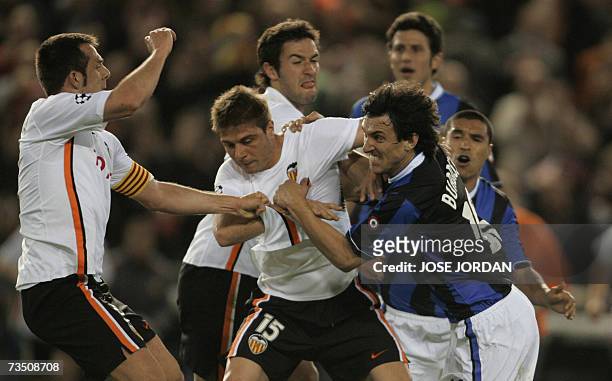 Valencia?s Carlos Marchena and Joaquin fight with Inter?s Argentinian Nicolas Burdisso during their Champion league football match at Mestalla...
