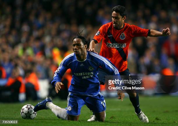 Didier Drogba of Chelsea battles for the ball with Ibson of FC Porto during the UEFA Champions League round of sixteen, second leg match between...