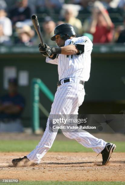 Robert Andino of the Florida Marlins hits against the Boston Red Sox during a Spring Training game on March 6, 2007 at Roger Dean Stadium in Jupiter,...