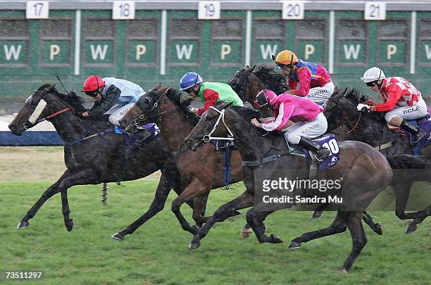 Michael Coleman riding Lady Atire leads Mark Du Plessis riding Waitui Zone and Allan Peard riding I'm Isaac in ABN Amro Salver race during the...