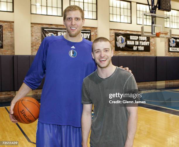 Dirk Nowitzki of the Dallas Mavericks poses with singer Justin Timberlake after a game of HORSE after a game against the New Jersey Nets at the...