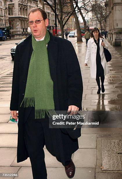 Prime Ministerial spokesman Tom Kelly walks ahead of Ruth Turner, Director of Government relations, near Downing Street on March 7, 2007 in London....