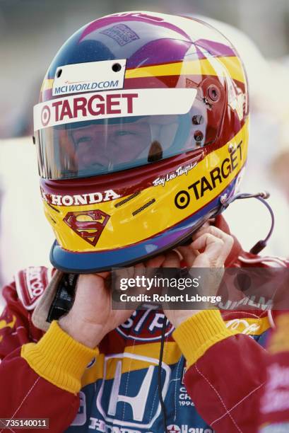 Jimmy Vasser of the United States, driver the Target Chip Ganassi Racing Reynard 99i Honda puts on his helmet during practice for the Championship...