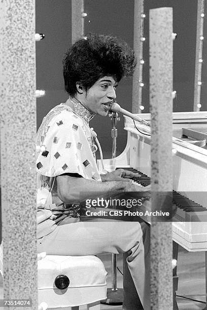 American rock and roll singer and pioneer Little Richard, born Richard Wayne Penniman, sings as he plays the piano on an episode of the CBS musical...