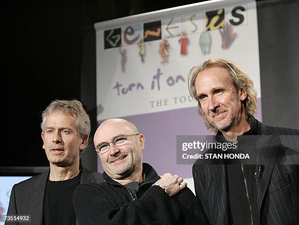 New York, UNITED STATES: Tony Banks, Phil Collinsand Mike Rutherford of the British rock group Genesis announce the "Turn It On Again" tour, 07 March...