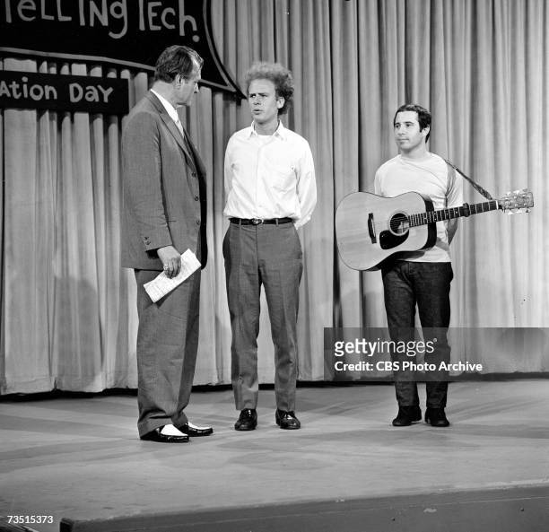 American clown, actor, and telelvsion host Red Skelton talks to folk-pop musicians Art Garfunkel and Paul Simon , of the duo Simon and Garfunkel, on...