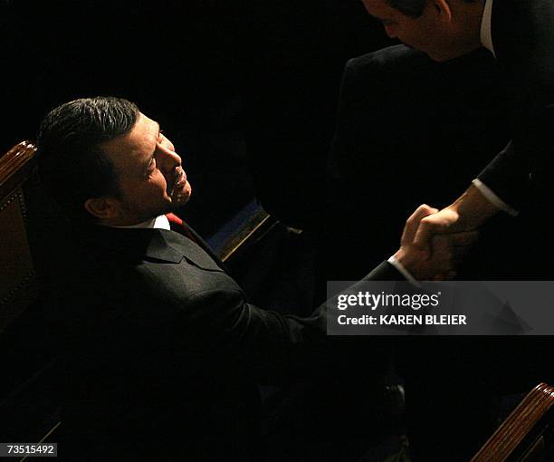 Washington, UNITED STATES: King Abdullah of Jordan greets members of the US Congress as he arrives toaddress to a joint session on Capitol Hill in...