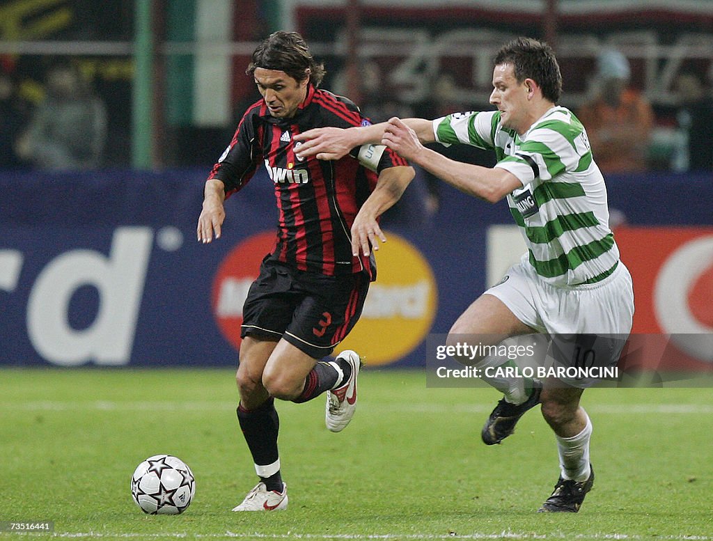 AC Milan defender Paolo Maldini (L) figh...
