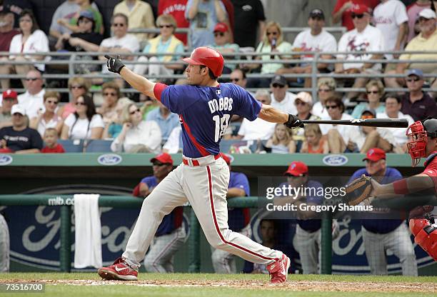 Greg Dobbs of the Philadelphia Phillies swings at the pitch against the Boston Red Sox during a Spring Training game at City of Palms Park March 3,...