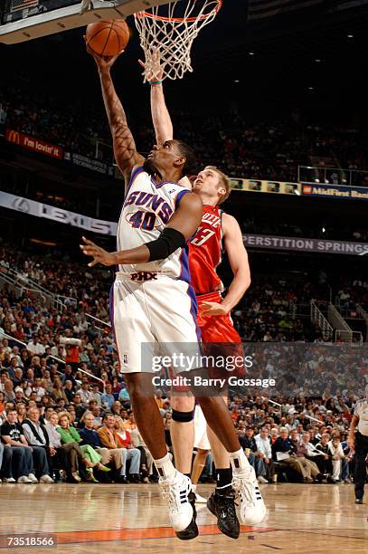 Kurt Thomas of the Phoenix Suns puts up a shot around Jake Voskuhl of the Charlotte Bobcats on March 7, 2007 at U.S. Airways Center in Phoenix,...