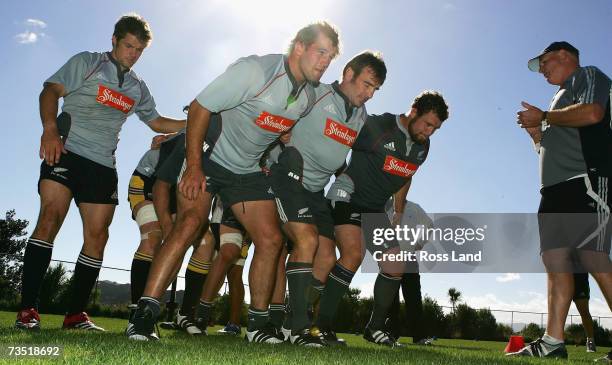 Richie McCaw , Carl Hayman , Andrew Hore and Tony Woodcock pack down as scrum coach Mike Cron looks on during a New Zealand All Blacks conditioning...