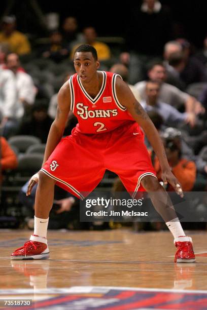 Anthony Mason Jr. #2 of the St. Johns Red Storm plays defense against the Marquette Golden Eagles during the first round of the Big East Championship...