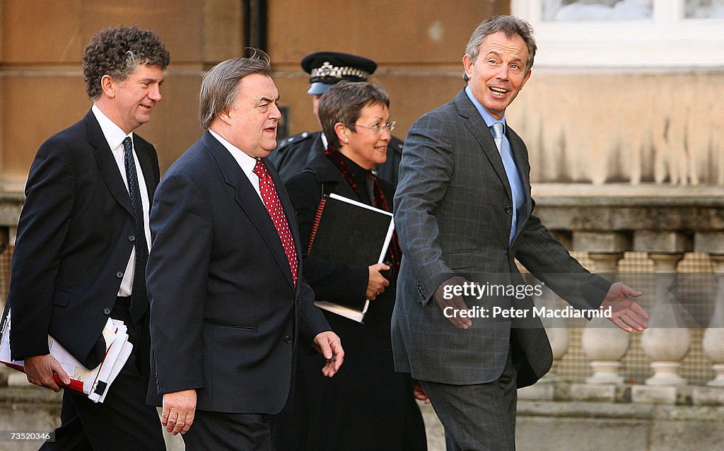 Prime Minister Tony Blair gestures as he walks to a cabinet meeting