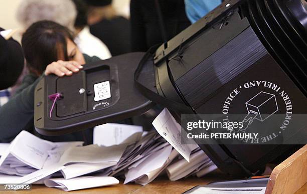 United Kingdom: Elections officials empty a ballot box in a polling station in Belfast, Northern Ireland, 08 March 2007. Counting began today in...