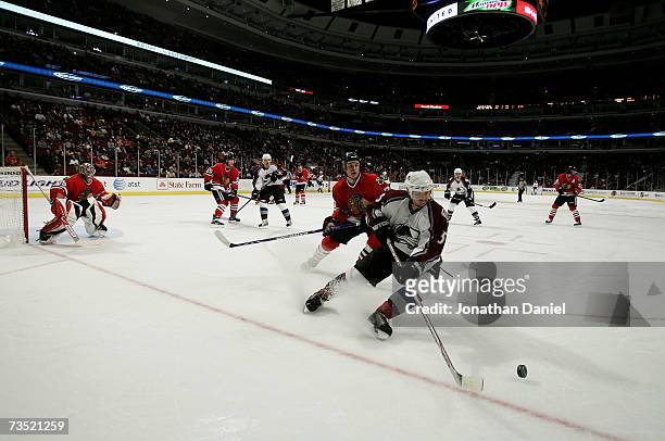 Brett Clark of the Colorado Avalanche controls the puck in the corner against the Chicago Blackhawks March 1, 2007 at the United Center in Chicago,...