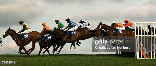 Runners clear the first hurdle during The Subscribe To Racing UK Handicap Hurdle Race run at Wincanton Racecourse on March 8 in Wincanton, England.