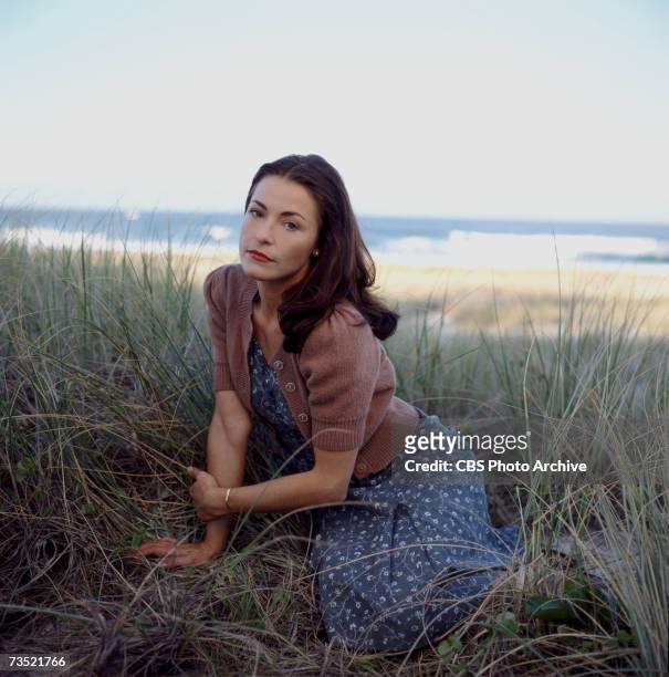 Promotional portrait of British actress Amanda Donohoe , as she reclines on the grass for the television mini-series 'The Thorn Birds: the Missing...