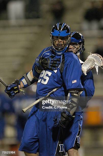 Zack Greer of the Duke Blue Devils is grabbed by a teammate after scoring against the Maryland Terrapins on March 2, 2007 at Byrd Stadium in College...