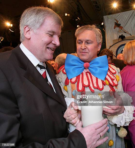 German Agriculture and Consumer Protection Minister Horst Seehofer and his comedian double Horst Zrenner chat in Nockherberg beer hall as the strong...