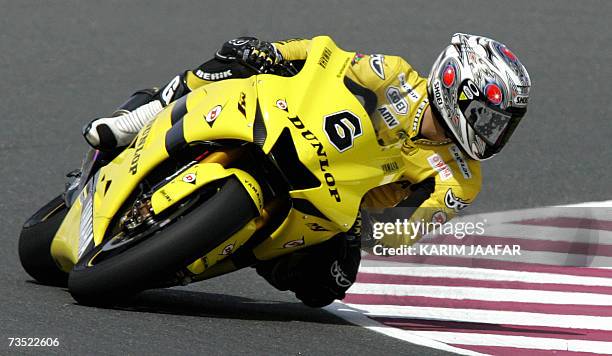 Japanese Makoto Tamada of Yamaha speeds during a practice session at the Losail International Circuit on the outskirts of the Qatari capital Doha, 08...