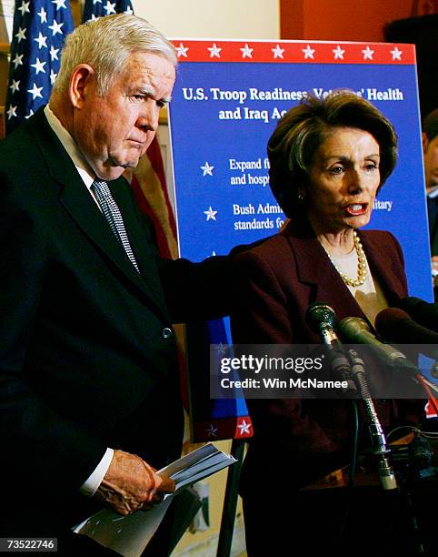 Rep. John Murtha puts his hand on the shoulder of Speaker of the House Nancy Pelosi while she speaks during a Capitol Hill press conference March 8,...