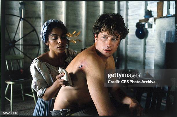 American actors Jasmine Guy and Timothy Daly appear in a scene from the television mini-series 'Queen,' directed by John Erman, in which Berry plays...