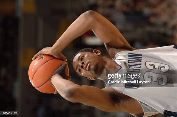 Patrick Ewing Jr. #33 of the Georgetown Hoyas shoots a foul shot during a college basketball game against the Connecticut Huskies at Verizon Center...