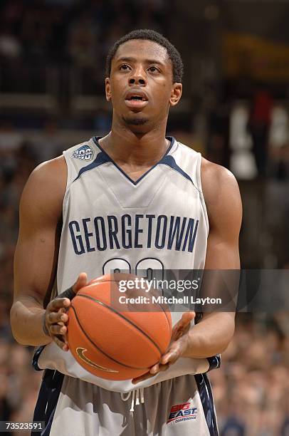 Patrick Ewing Jr. #33 of the Georgetown Hoyas shoots a foul shot during a college basketball game against the Connecticut Huskies at Verizon Center...