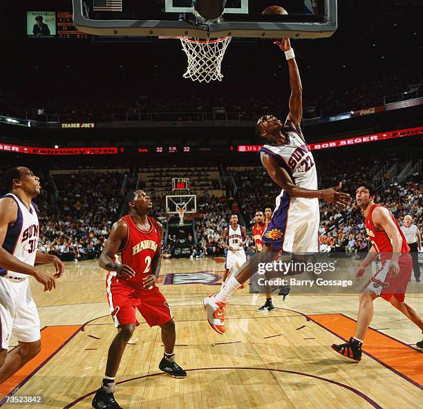 James Jones of the Phoenix Suns shoots a layup against Joe Johnson of the Atlanta Hawks during a game at US Airways Center on February 9, 2007 in...
