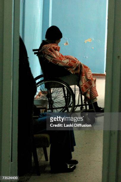 Cancer patient awaits treatment in the town hospital, in this photo taken in January 2007 in the town of Mailuu-Suu in Kyrgystan. According to the...