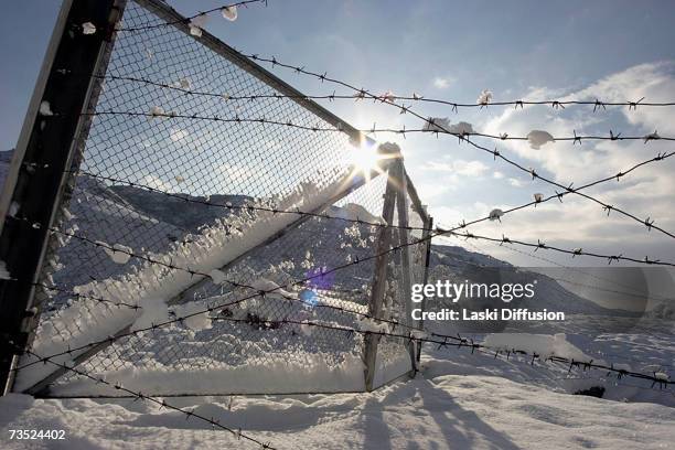 Light dusting of snow sits on the ruins of an old Soviet uranium plant, in this photo taken in January 2007 in the town of Mailuu-Suu in Kyrgystan....