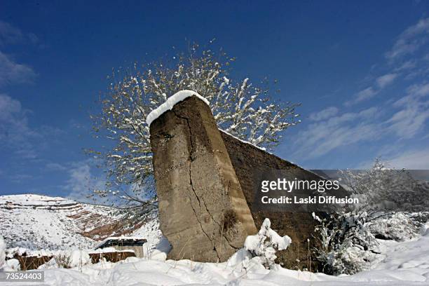 Light dusting of snow sits on the ruins of an old Soviet uranium plant, in this photo taken in January 2007 in the town of Mailuu-Suu in Kyrgystan....