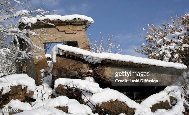 Light dusting of snow sits on the ruins of an old Soviet uranium plant, in this photo taken in January 2007 in the town of Mailuu-Suu in Kyrgystan....