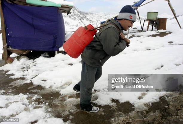 Kyrgyz labourers inhabit primitive camps close to the ruins of an old Soviet elctrolamp factory, where they scrape a living scavenging for nickel and...