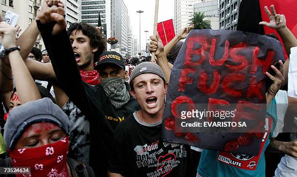 Demonstrators shout slogans during a protest against the visit of US President George W. Bush, 08 March 2007, in the main avenue of the Brazil's...