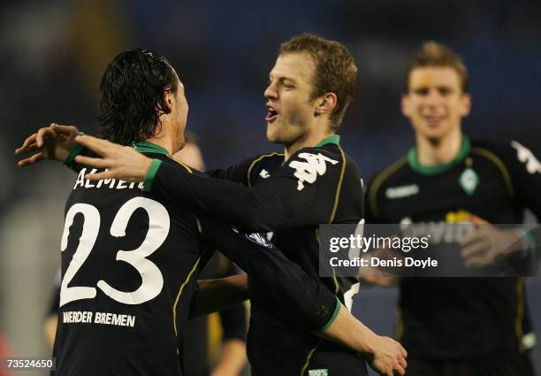 Hugo Almeida of Werder Bremen is congratulated by Daniel Jensen after scoring a goal during the UEFA Cup Round of 16, First Leg, match between Celta...