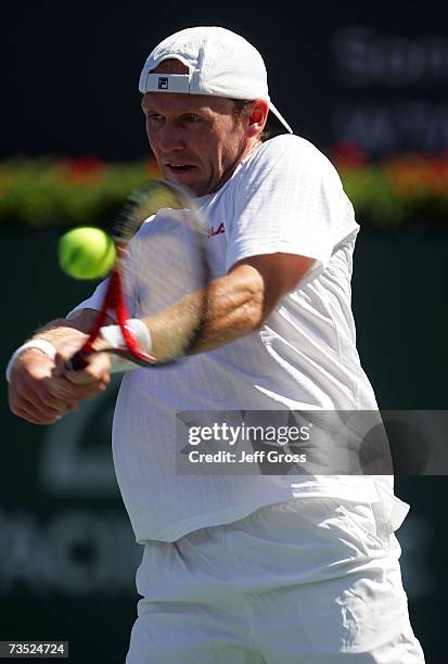 Rainer Schuettler of Germany returns a backhand to Stefano Galvani during the Pacific Life Open on March 8, 2007 at the Indian Wells Tennis Garden in...