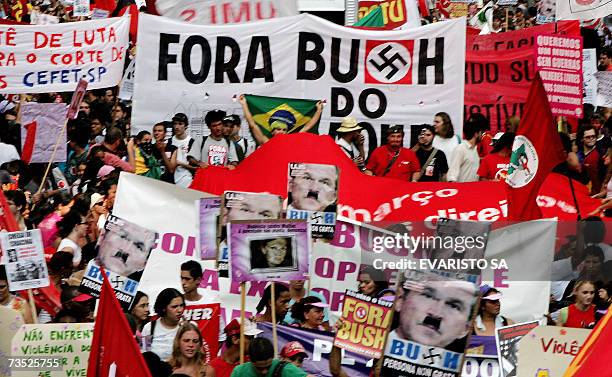 Demonstrators hold banners against the visit of US President George W. Bush, 08 March 2007, during a protest march along the main avenue of the...